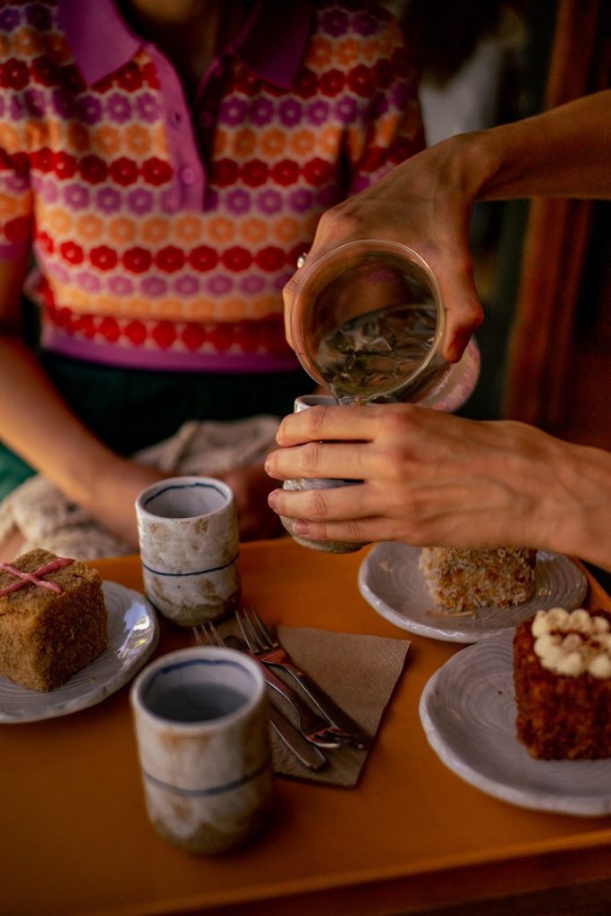 Things to do in Newtown & Enmore, Sydney Australia 2 Hands pouring water into drinking glasses